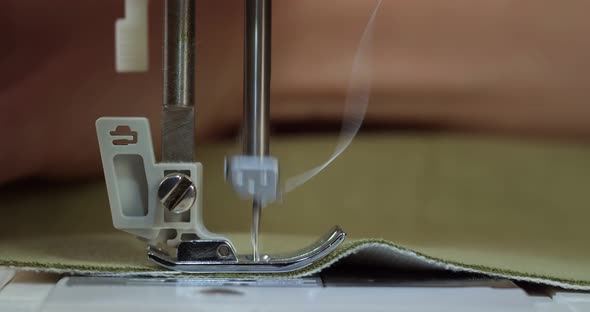 Dressmaker Working on Sewing Machine Closeup