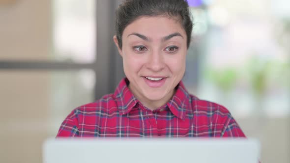 Close Up of Indian Woman Celebrating Success on Laptop