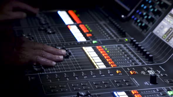 Person operating sound editing table, panoramic view