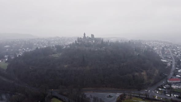 Aerial footage of Braunfels castle on a gloomy winter day. Aerial approaching shot