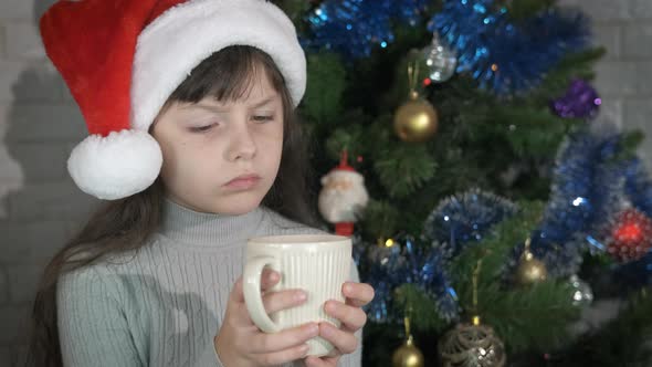 Christmas holiday with unhappy child in room.