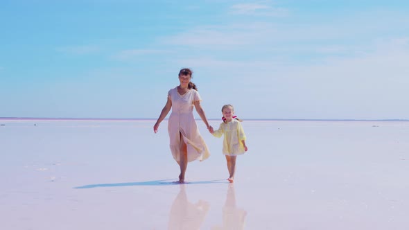 Mother and Daughter Walk Along Salt Lake