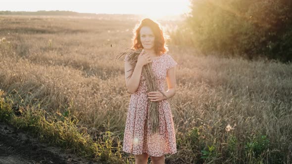 Beautiful Redhead Girl at Sunset