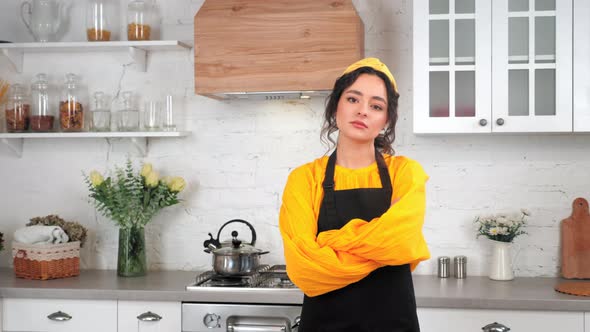 Portrait Serious Housewife Crossing Hands Looking Camera in Home Modern Kitchen