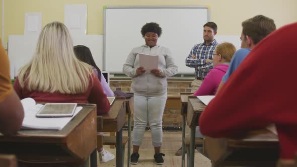 African American high school girl presenting to a group of teenagers
