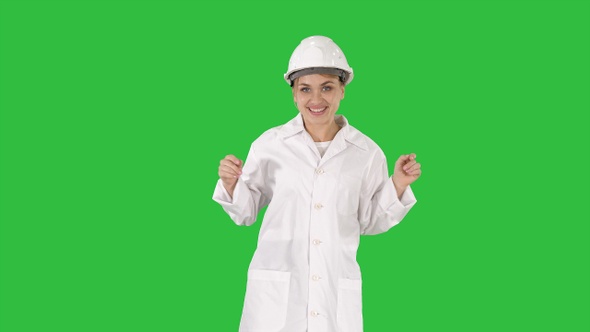 Female engineer dancing on a Green Screen, Chroma Key