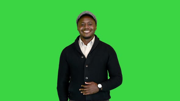 Handsome Black Man Smiling for the Camera on a Green Screen Chroma Key