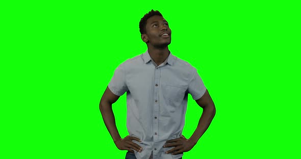 Man looking around against green screen