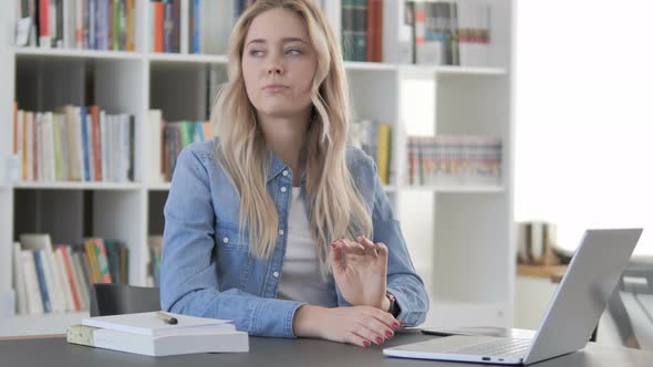 Young Woman Waiting for Meeting Watching Time