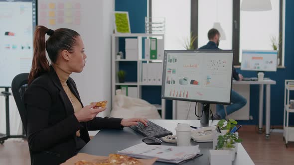 Businesswoman Having Delivery Food Order on Desk During Takeout Lunchtime Working in Business