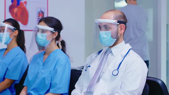 Group of Medical Staff with Protection Wear