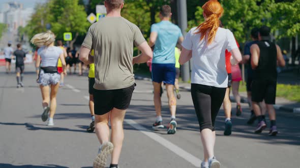 Couple Running City Marathon in Slow Motion