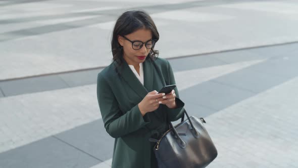 Businesswoman Using Mobile Phone Outdoors