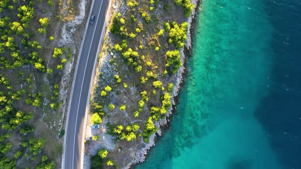 View of the road along the coast from the drone. Travel by car in summer time.