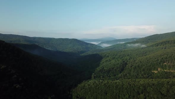 Aerial Landscape View of Caucasus Mountain at Sunny Morning with Fog