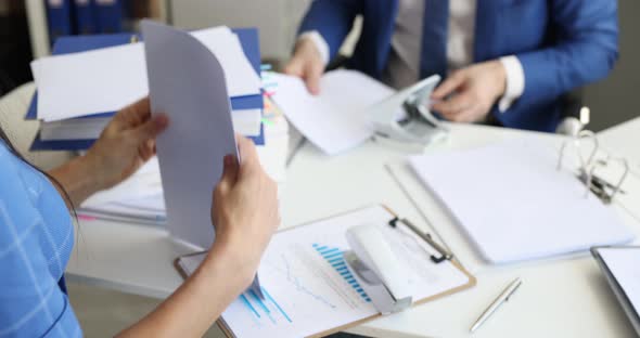 Man and Woman Sorting Documents and Putting Them in Folders in Office  Movie Slow Motion