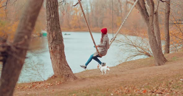 Walk By the River with a Pet in the Fall