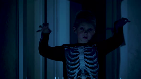 Boy portrays a zombie or skeleton