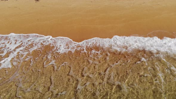 Aerial Top View of Ocean Blue Waves Crashing on the Beach