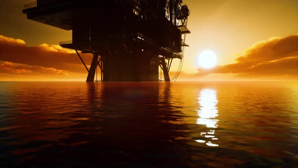 Aerial View Offshore Drilling Rig at the Offshore Location During Sunset