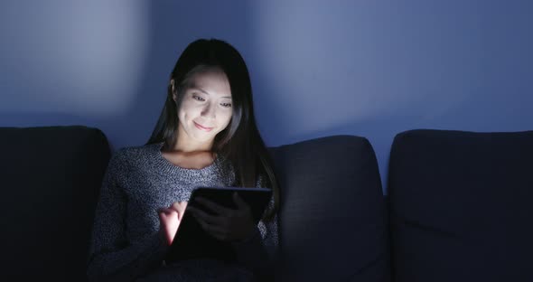 Woman use of digital tablet computer at home 