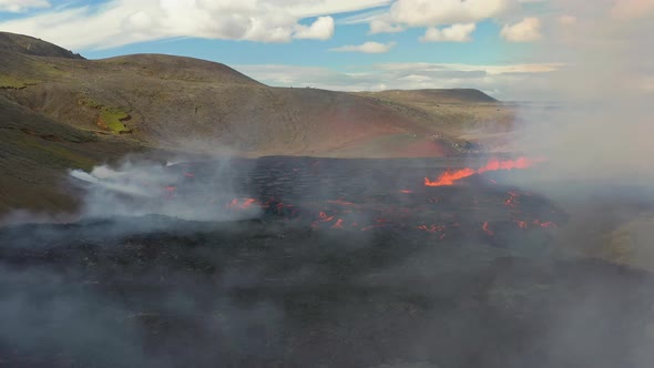 Fagradalsfjall Iceland Volcano. 4K Aerial Drone Shot Of Rocky Volcanic Plain Covered In White Smoke