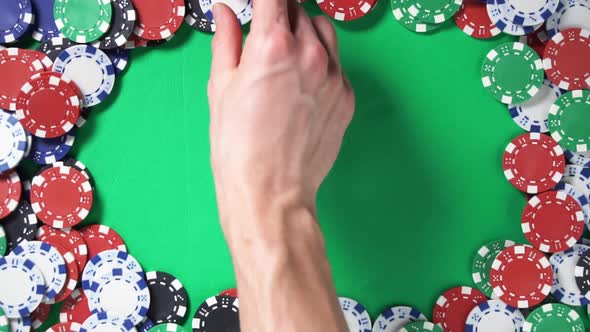 Close-up of Hand Throwing Double Dice on Green Table with Poker Chips Win Pair in Slow Motion