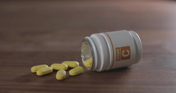Vitamin C Pill on a Brown Table