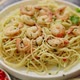Spaghetti with Shrimps on White Ceramic Plate and Served with Glass of White Wine - VideoHive Item for Sale