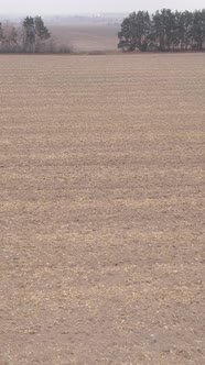 Vertical Video of a Field with Plowed Land in Autumn Slow Motion