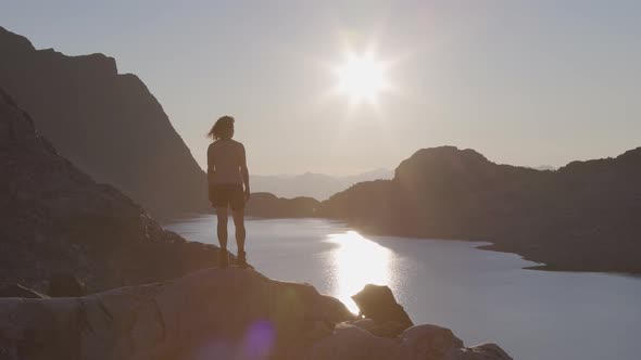 Adventurous Caucasian Adult Woman Hiking on Top of a Canadian Rocky Mountain