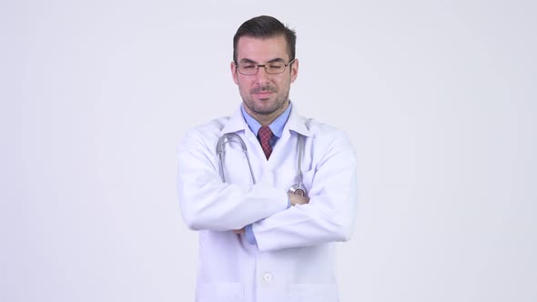 Young Happy Hispanic Man Doctor with Arms Crossed