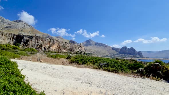 Panning to right at Baia Santa Margherita and surrounding landscape in western Sicily coast close to