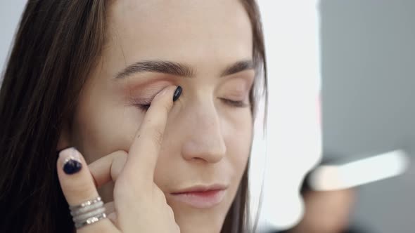 Cropped View of Girl's Face in Process of Doing Makeup