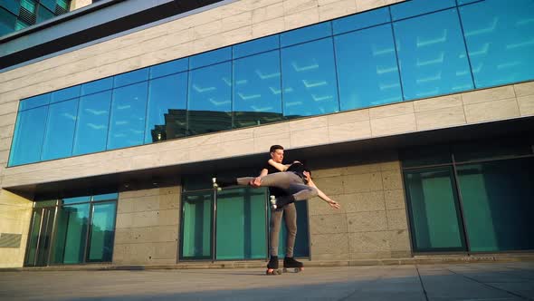 Couple Performing Choreography on Roller Skates