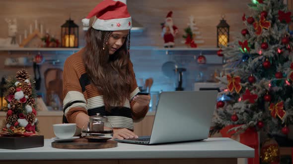 Festive Woman Holding Credit Card to Shop Online