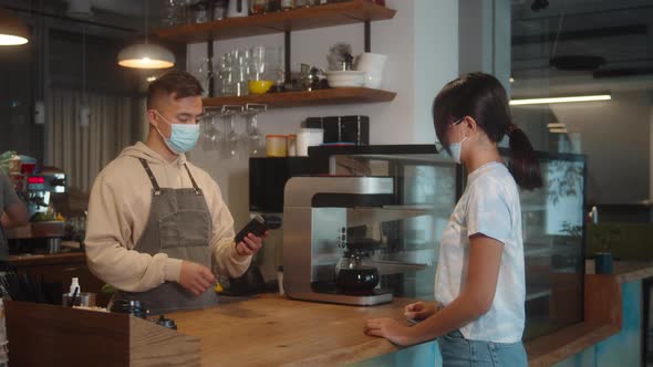 Asian Man in Medical Face Mask in Coffee Shop Using Sanitizer Lockdown Quarantine Coronavirus is