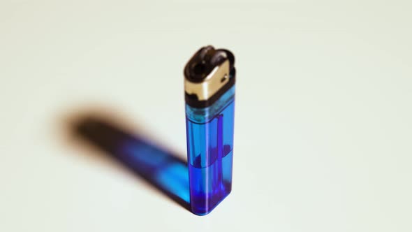 Blue Lighter Rotates on a White Background