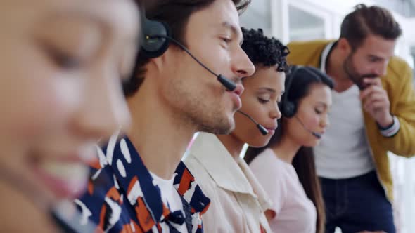 Call centre staff working in a modern office