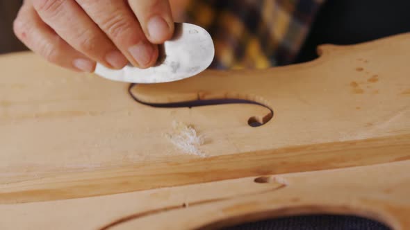 Female luthier at work in her workshop