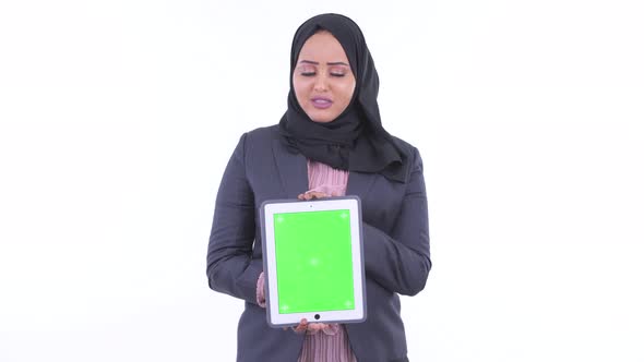 Stressed Young African Muslim Businesswoman Showing Digital Tablet