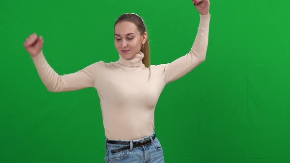 Proud Confident Slim Woman Making Strength Gestures at Chromakey Background Looking at Camera