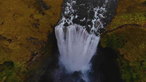 Powerful waterfall in green highlands