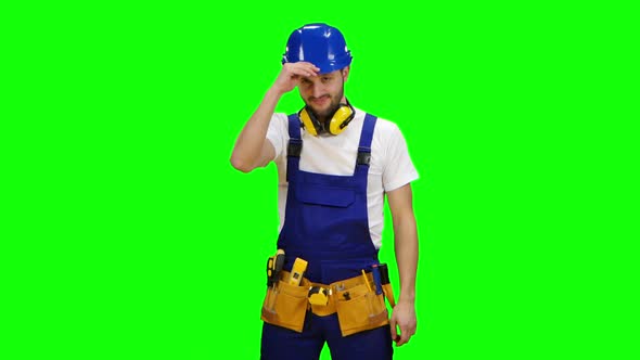 Builder Wears a Hard Hat and Smiles. Green Screen