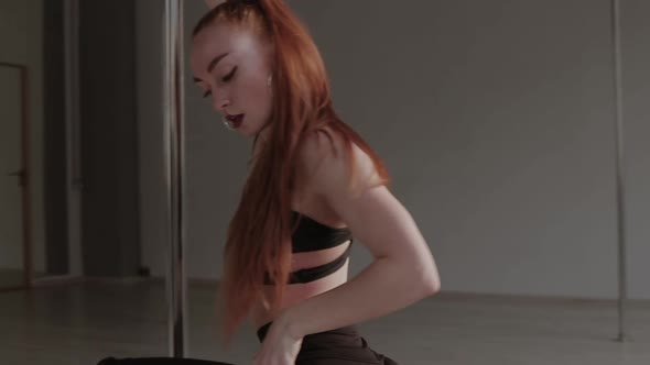 Fit Woman Dancing Erotic Dance in Studio