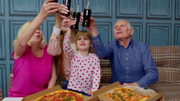 Happy Multigenerational Family Having Lunch Party at Home Eating Pizza Food Raising Toast Together