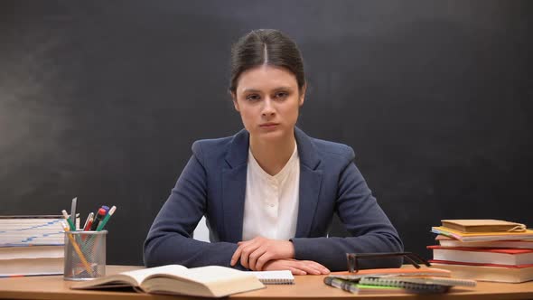 Tired Overworked Female Teacher Looking to Camera, Troubles at Work