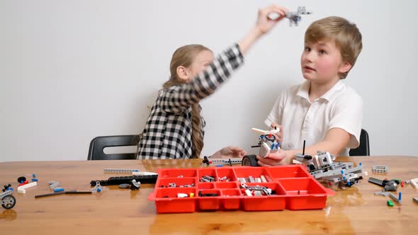 Young Friends Having Fun Using Building Kit