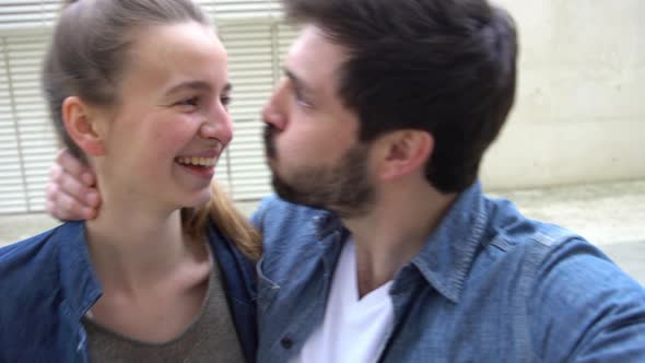 Couple goofing off together while posing for a selfie