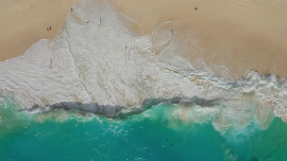 Aerial View of White Sand Beach with Tourists and Azure Blue Water, Ocean Waves 